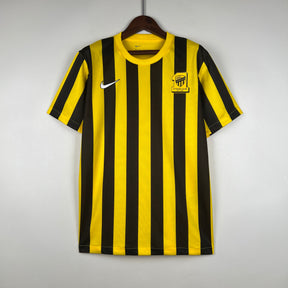 Camisa Al-Ittihad Home 2023/24 - Nike Torcedor Masculina - Amarela/Preta